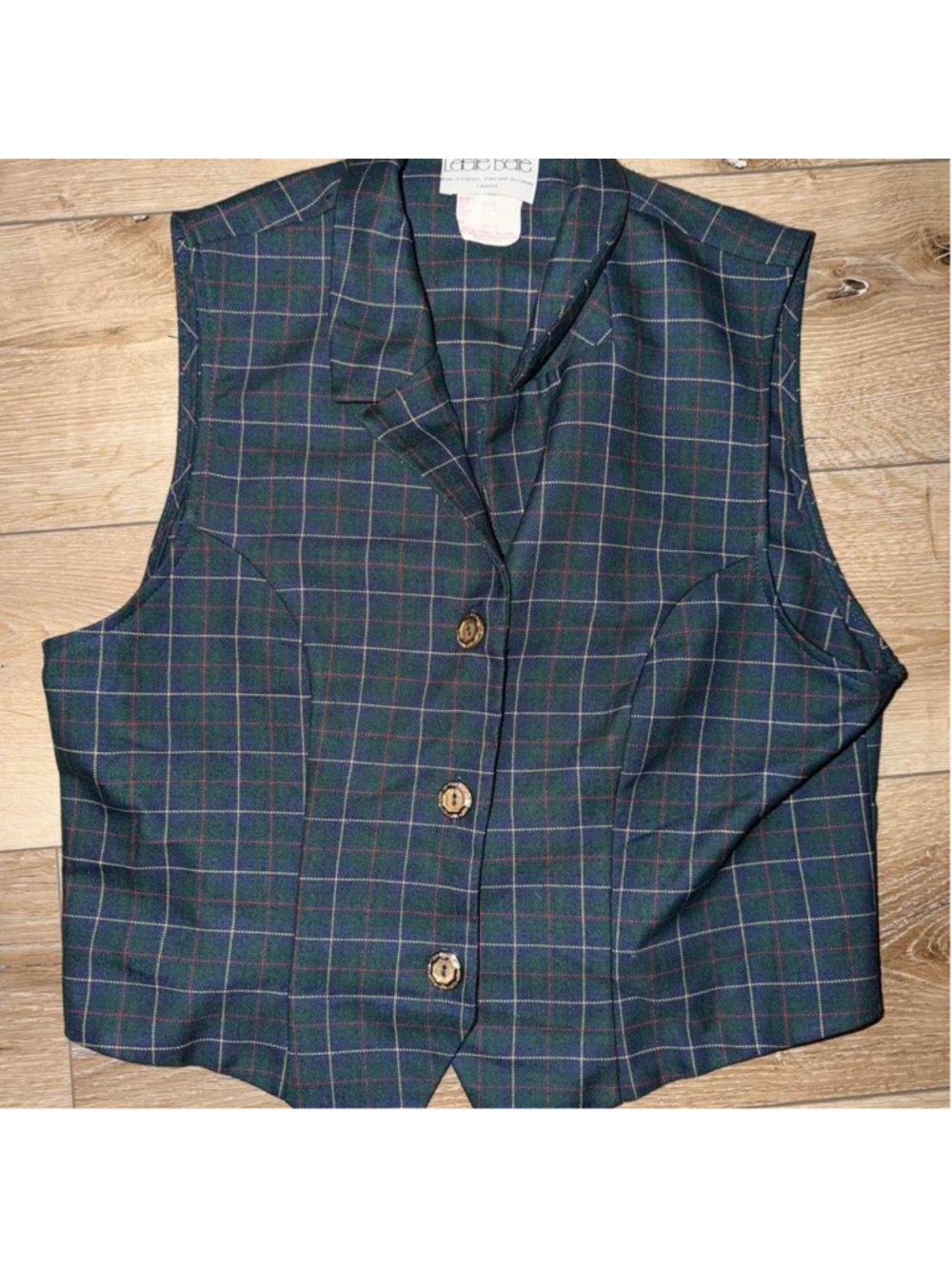 Vintage tartan plaid vest with a classic green and navy base, red/yellow accents